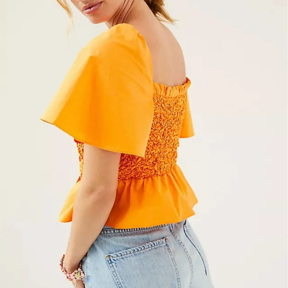 *Anthropologie Smocked Bow Tie Top Size Medium